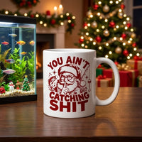 Funny Christmas Fishing Santa You Ain’t Catching Shit Ceramic Mug