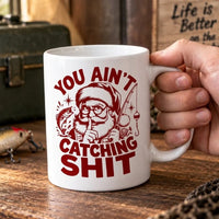 Funny Christmas Fishing Santa You Ain’t Catching Shit Ceramic Mug
